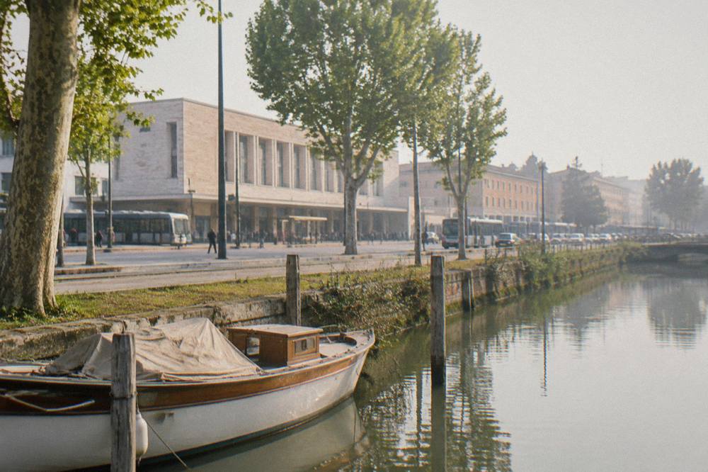 Boat moored on the Brenta river beside a Venetian villa