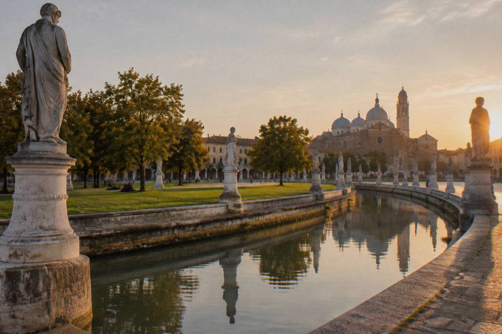 Prato della Valle in Padua with its canal ring and statues in daylight