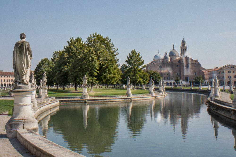 View across the canal-ringed Prato della Valle square in Padua with its ring of statues
