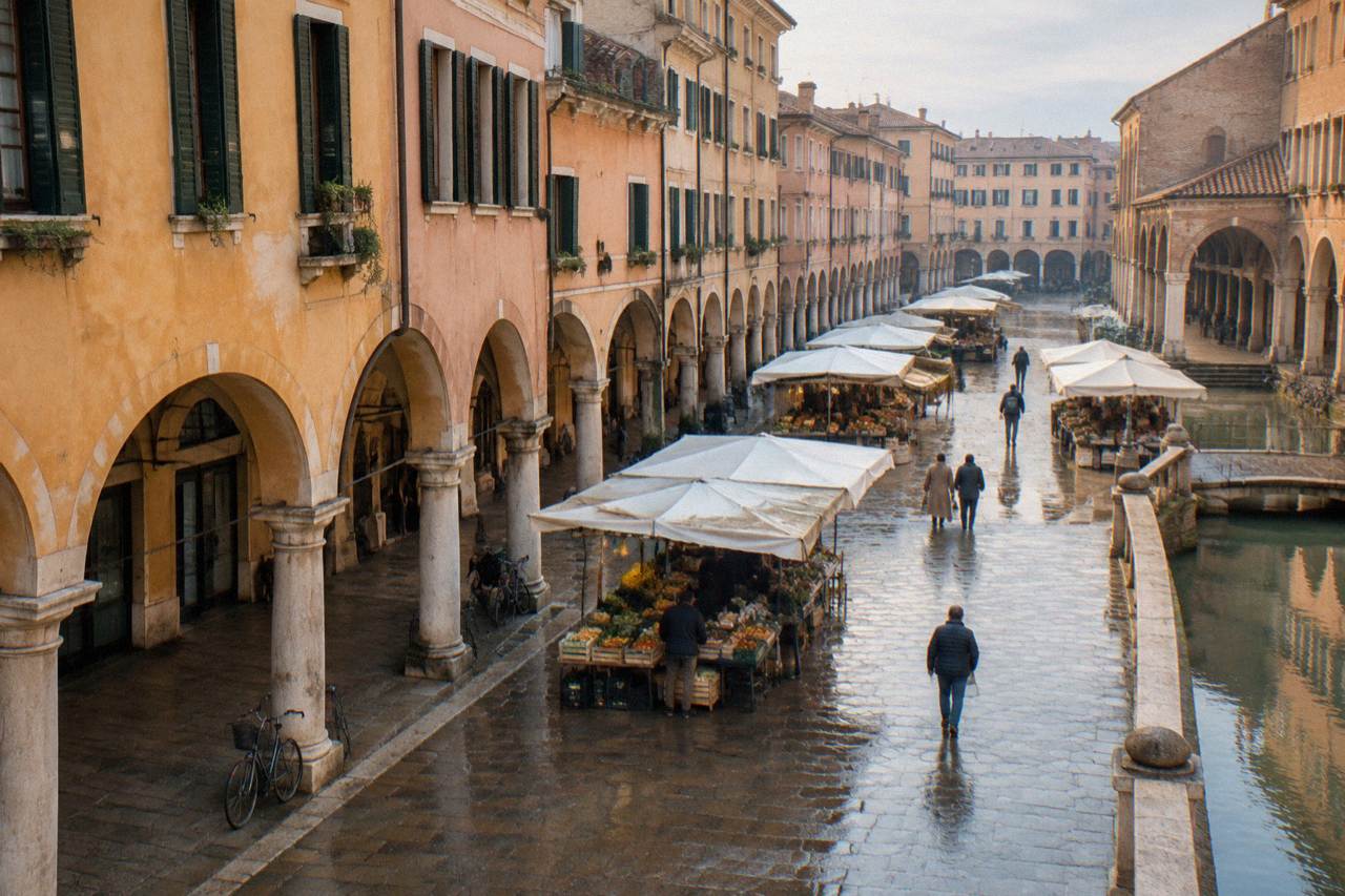 Arcaded historic centre of Padua with market stalls under medieval buildings
