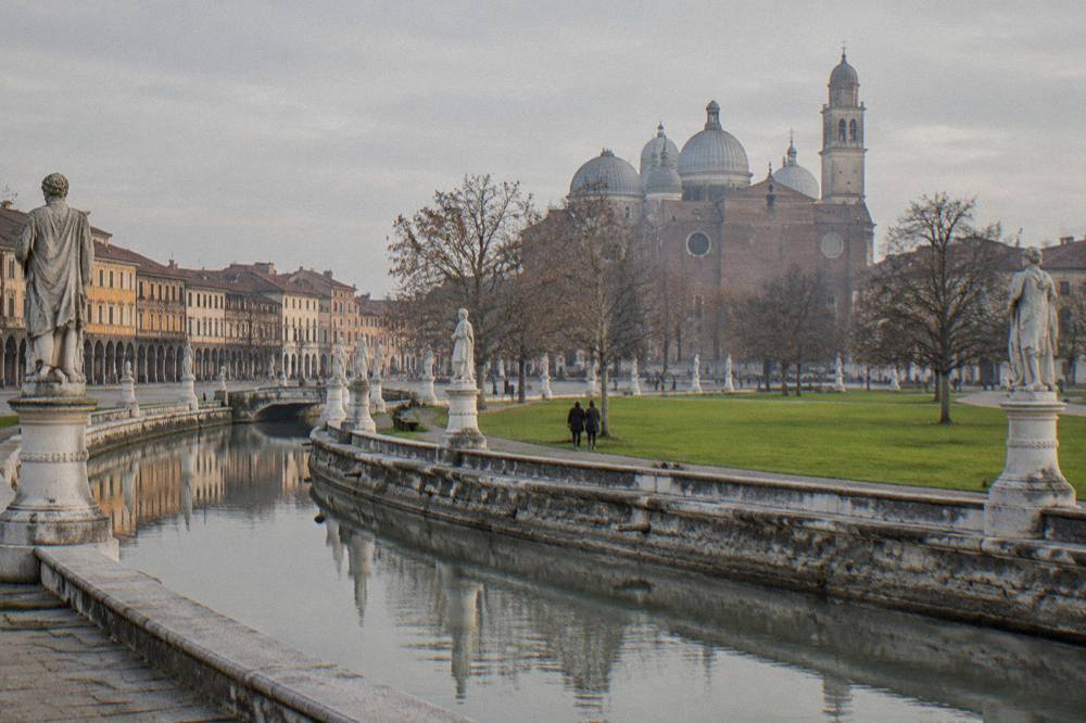 Fountain and statue-lined canal at Prato della Valle in Padua