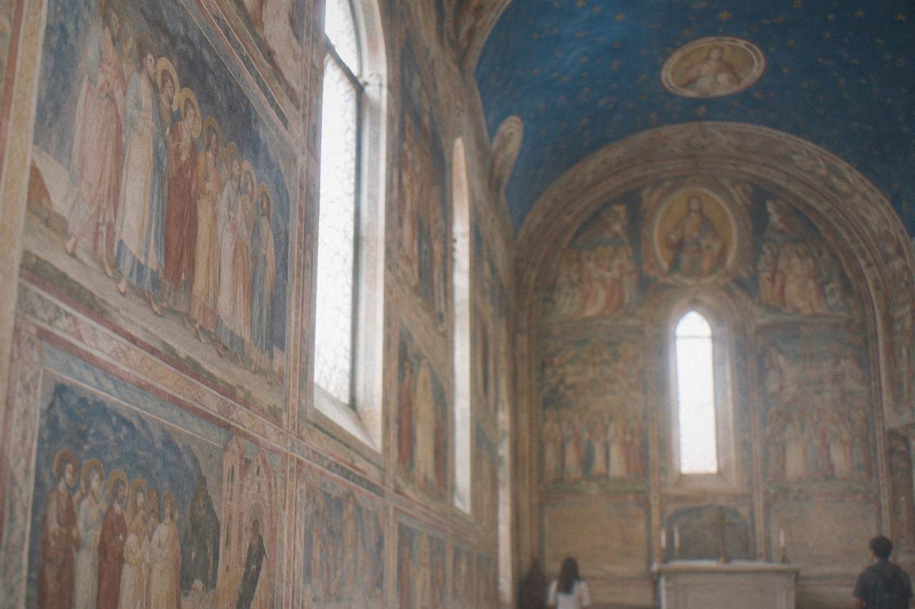 The blue vaulted ceiling and frescoed walls of the Scrovegni Chapel in Padua
