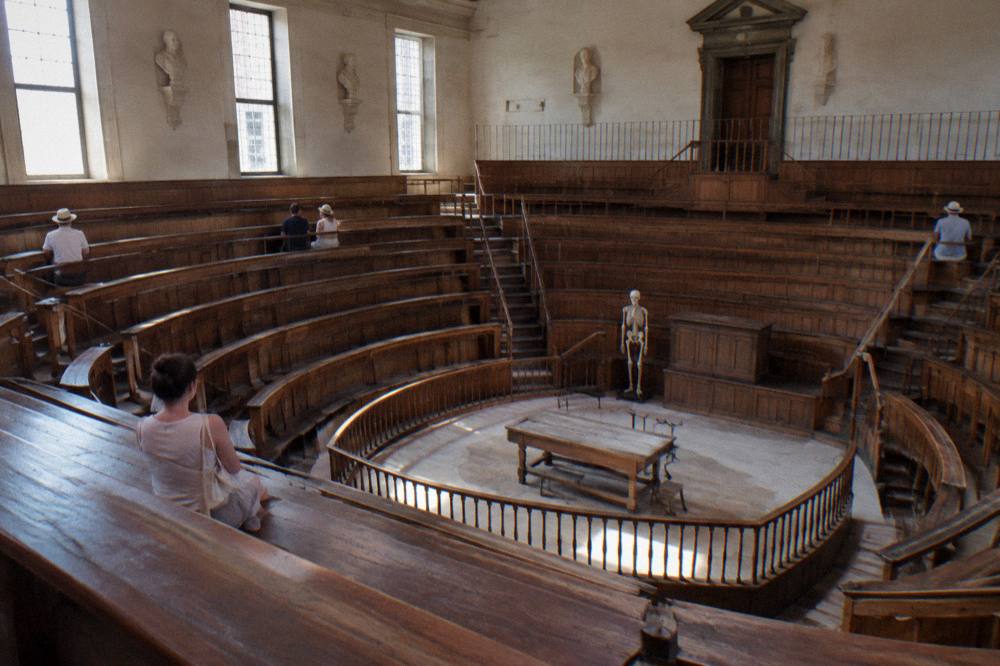 Wooden tiers of a historic anatomical theatre inside an old university hall