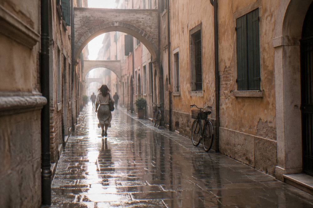 A rain-washed narrow street in an Italian city with reflections on the paving