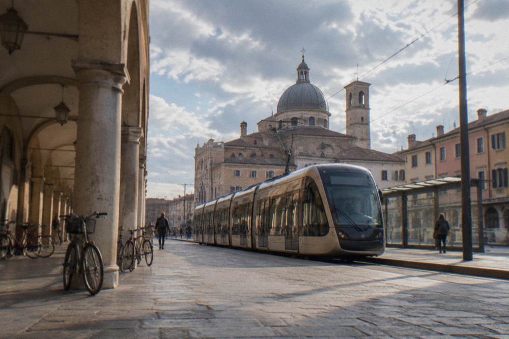 A tram stopping on the forecourt outside Padua railway station