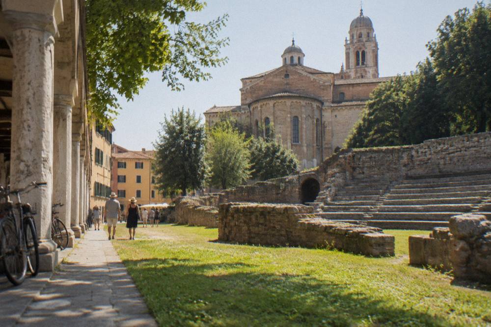 Afternoon light on the gardens and Roman amphitheatre remains beside the Eremitani Church in Padua