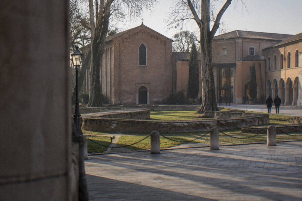 Evening view across the Eremitani square with the Scrovegni Chapel building and museum entrance in Padua