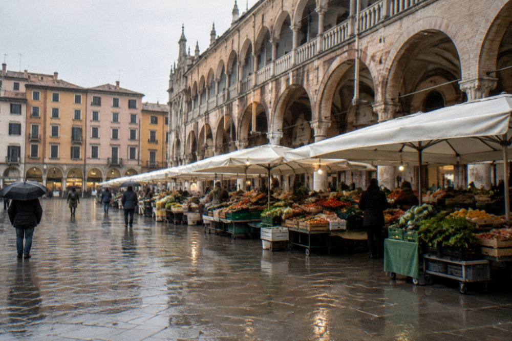 A market square with stalls under arcades in Padua