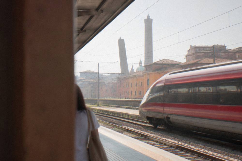 A high-speed train at a platform in an Italian railway station