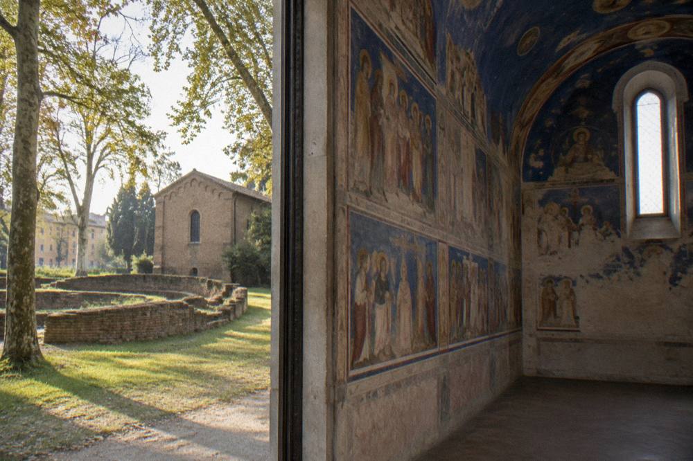 The blue-painted interior of the Scrovegni Chapel with Giotto frescoes on the walls