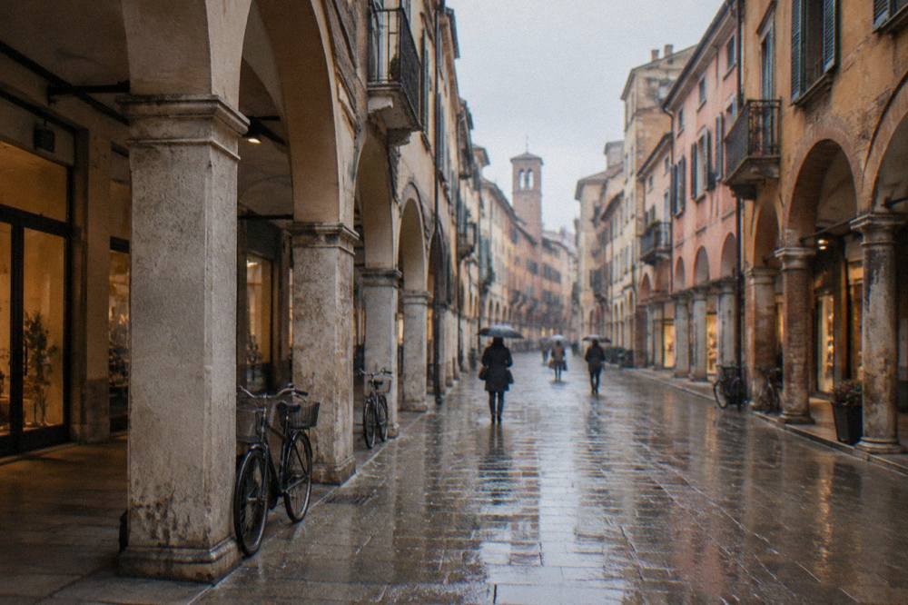 A flat arcaded street in Padua with a level pavement and shops
