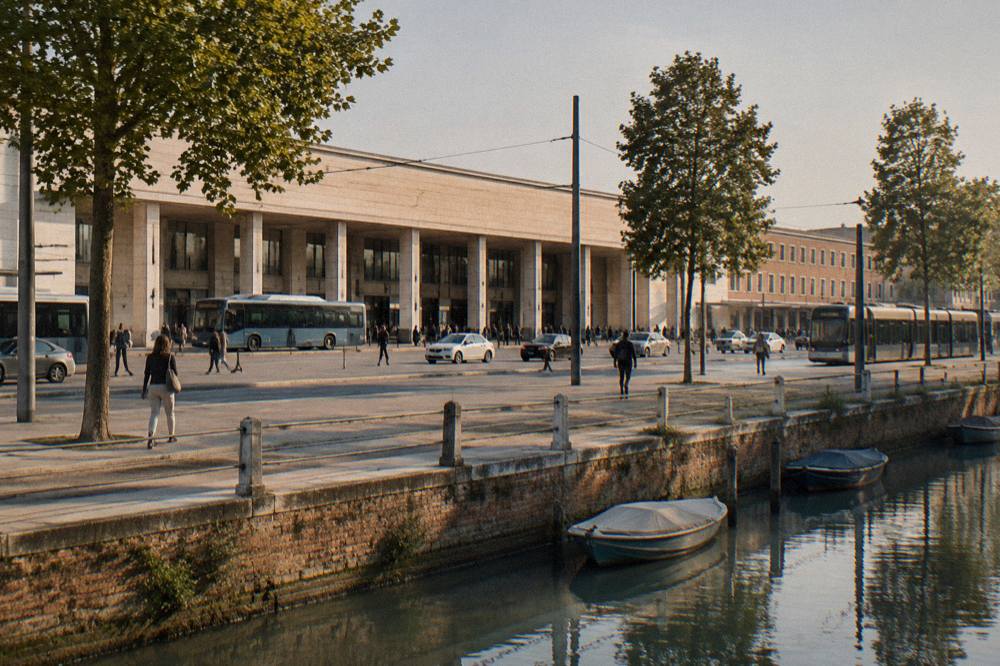 A canal with small boats and old brick facades in a northern Italian city at dusk