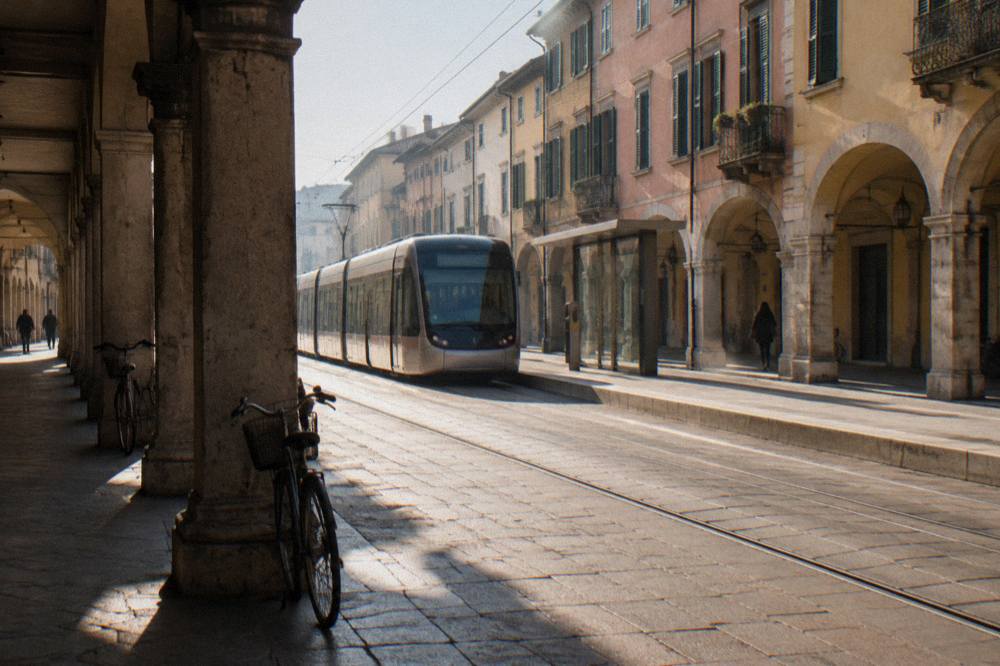 Modern Padua tram stopping at a low-platform stop in a city street