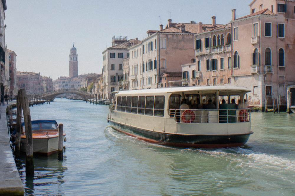 Vaporetto waterbus crossing a Venice canal near the railway station