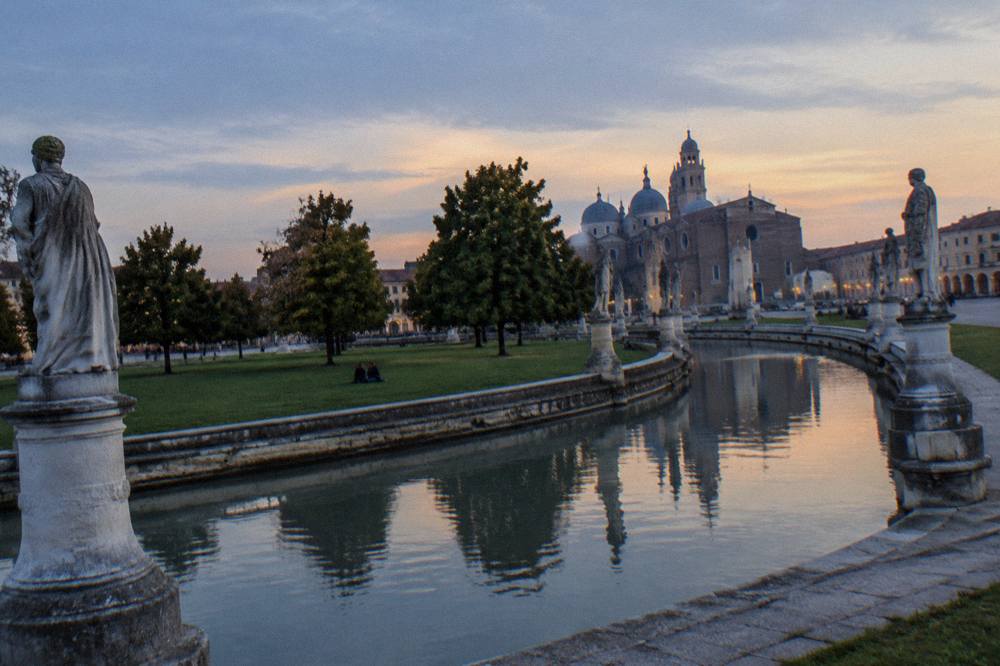 The canal encircling the island at Prato della Valle with statues along the water