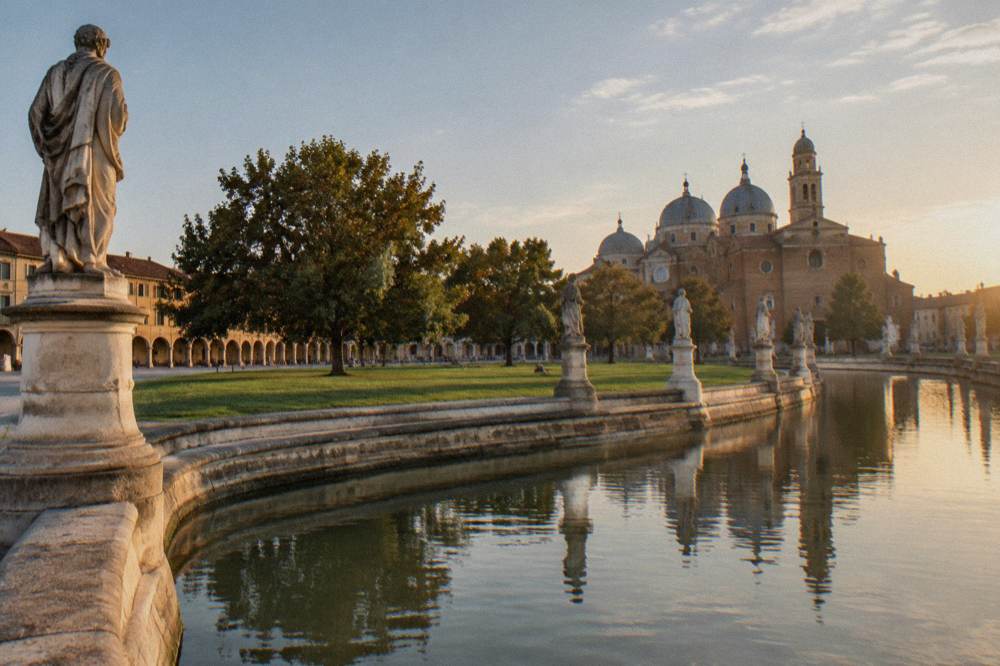 Prato della Valle in Padua with its canal ringed by statues and green lawns