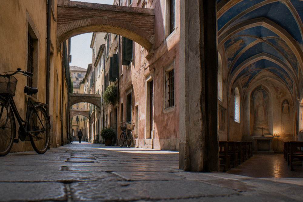 A medieval chapel interior with blue frescoed vaults lit softly at night