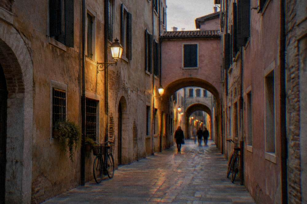 Outdoor cafe tables on an old arcaded street in the evening
