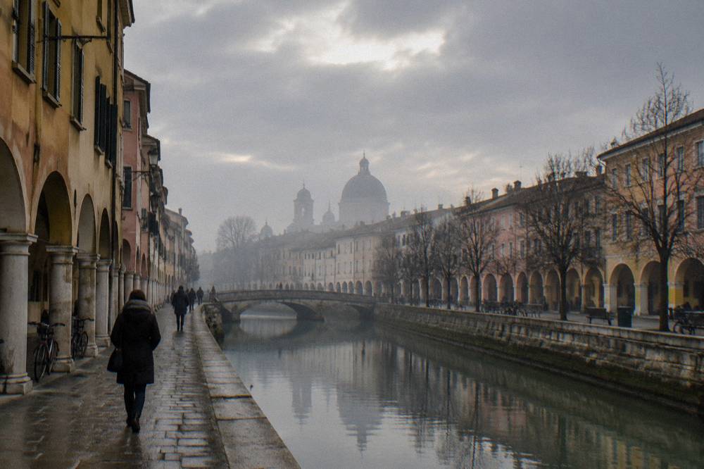 Foggy winter morning over rooftops and a dome in Padua