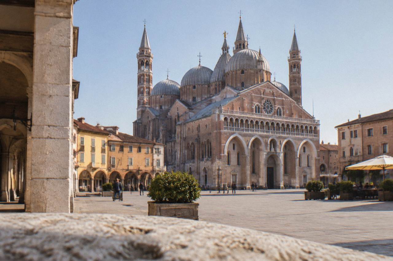 The domes and spires of the Basilica of Saint Anthony rising above a square in Padua