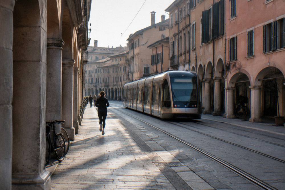 Modern tram travelling along a street in Padua near the railway station