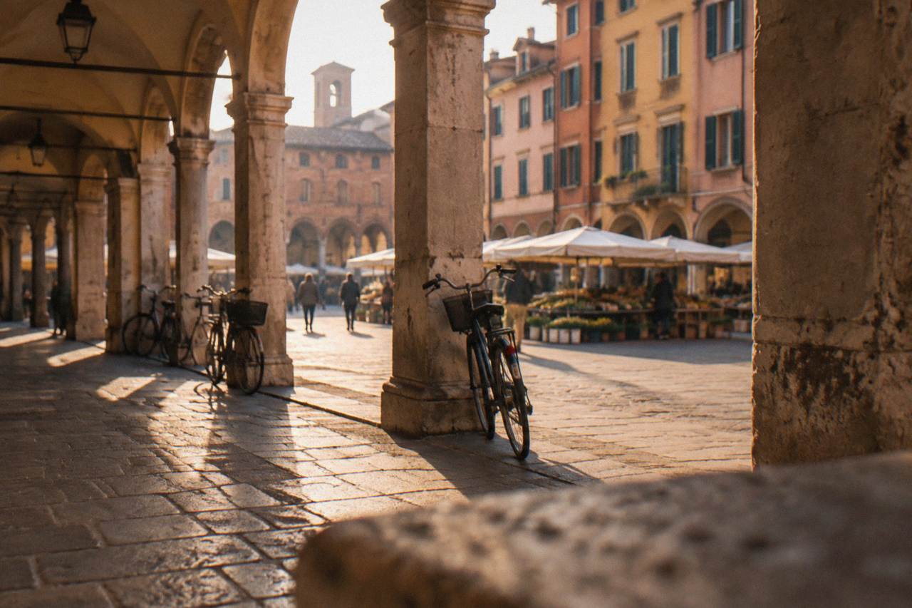 Arcaded street scene in central Padua with a market square in the background