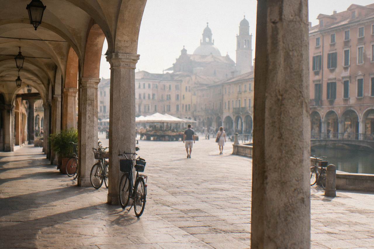 Arcaded street in the centre of Padua with market squares beyond